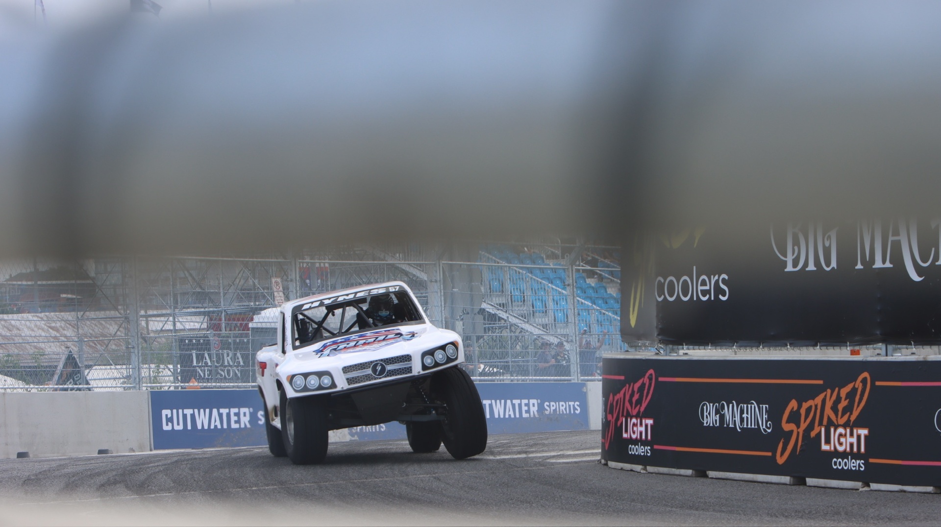 Bill Hynes driving the #57 Stadium SUPER Truck with the front wheels up