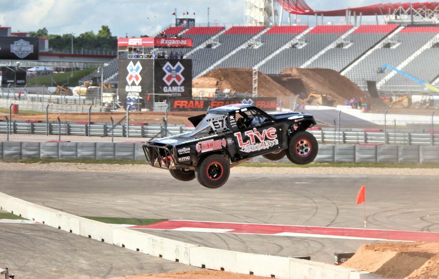 Bill Hynes flying in the Team UFD Racing number 57 Stadium SUPER Truck at X-Games